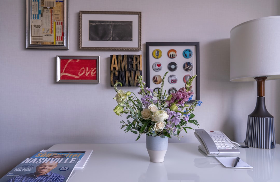 Wedding planning checklist and flowers on a desk